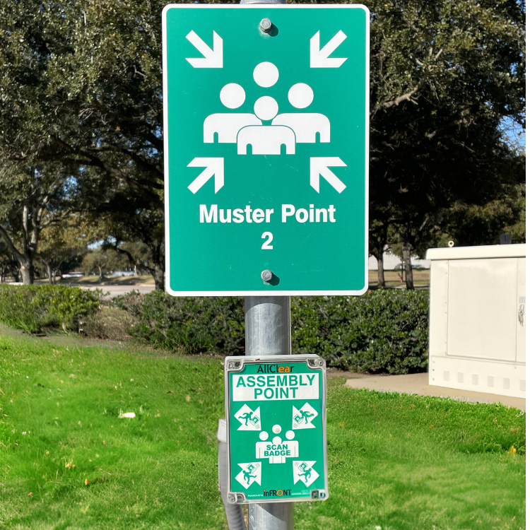 There is a sign in showing the mustering point of a high-hazard facility.